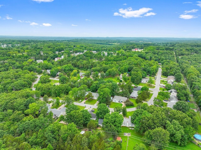 aerial view featuring a wooded view