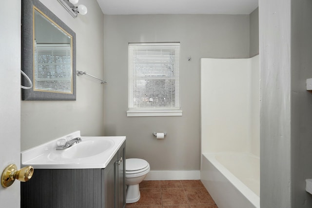 bathroom featuring tile patterned flooring, toilet, vanity, baseboards, and shower / bath combo with shower curtain