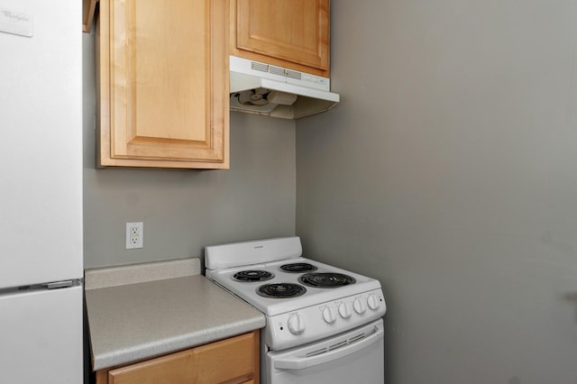 kitchen with white appliances, light countertops, under cabinet range hood, and light brown cabinetry