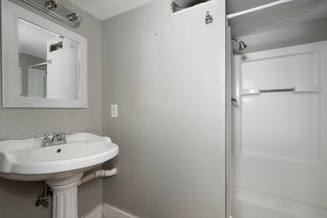 bathroom featuring walk in shower