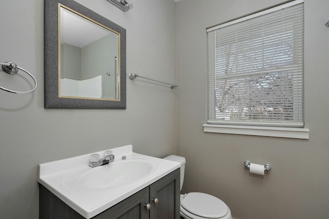 bathroom featuring vanity and toilet