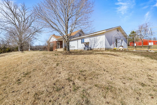 ranch-style house with a front lawn