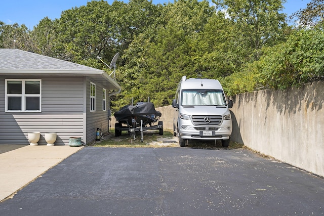 view of car parking with fence