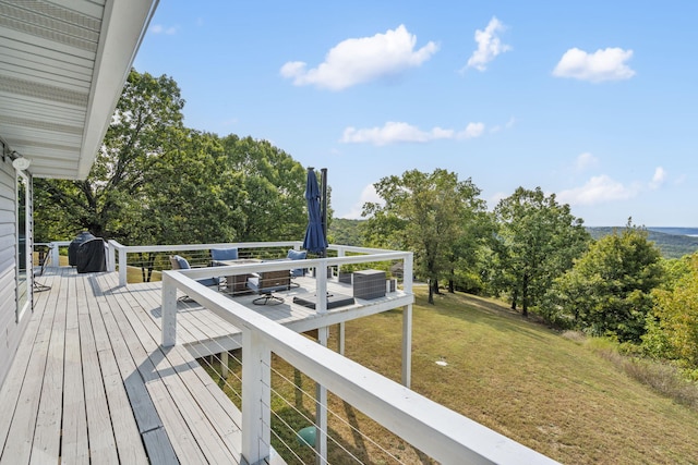 wooden terrace with a yard