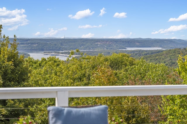 view of water feature featuring a mountain view and a view of trees