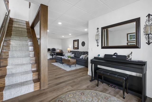 living area featuring stairway, wood finished floors, and recessed lighting