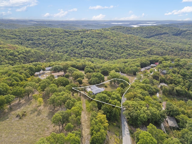 aerial view featuring a wooded view