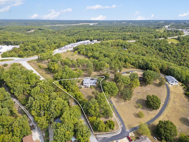 bird's eye view featuring a wooded view