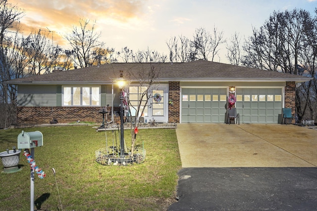 ranch-style home featuring concrete driveway and brick siding