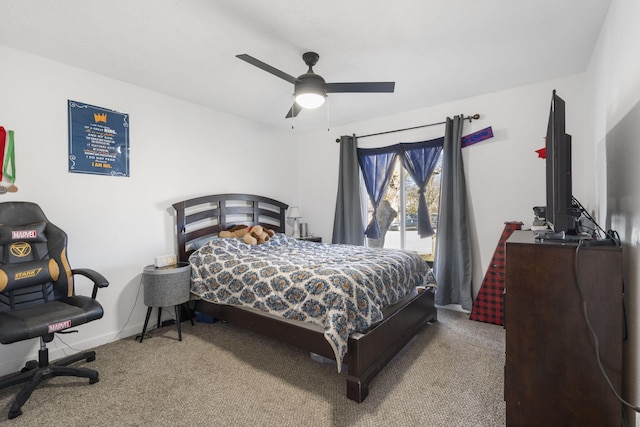 carpeted bedroom with baseboards and a ceiling fan