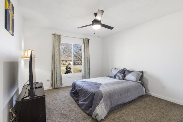 carpeted bedroom featuring a ceiling fan and baseboards