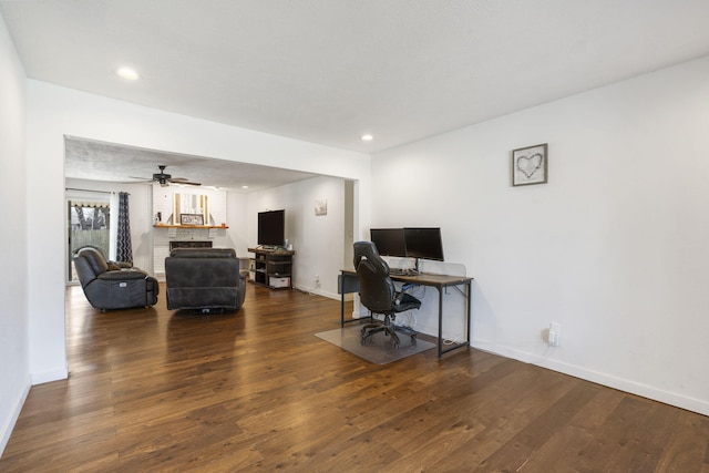 office area with recessed lighting, wood-type flooring, a fireplace, and baseboards