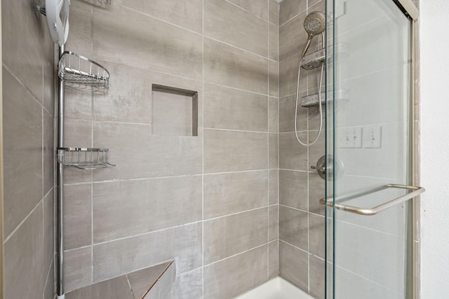 bathroom featuring a shower stall