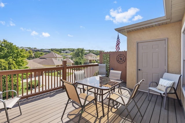 wooden deck featuring outdoor dining space