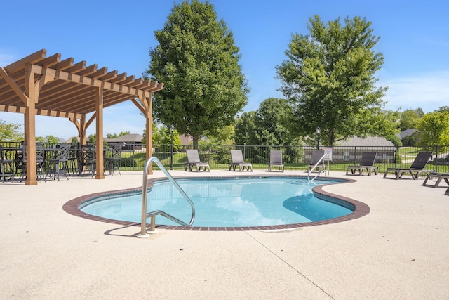 pool featuring a patio area, fence, and a pergola