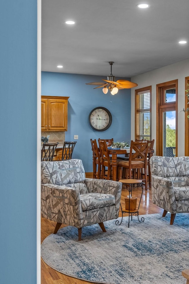 living room featuring recessed lighting, ceiling fan, and wood finished floors