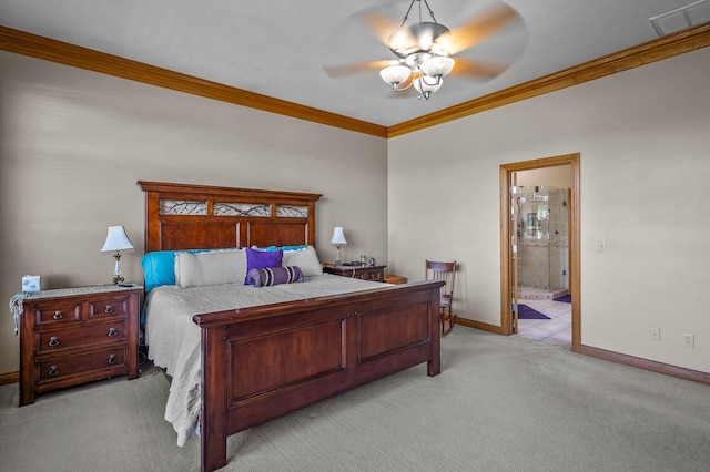 bedroom with carpet floors, visible vents, baseboards, ornamental molding, and ensuite bath