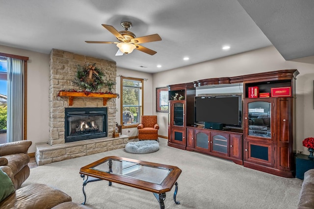 carpeted living area with recessed lighting, a fireplace, baseboards, and ceiling fan