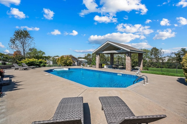 view of pool with a gazebo, a patio area, fence, and a fenced in pool