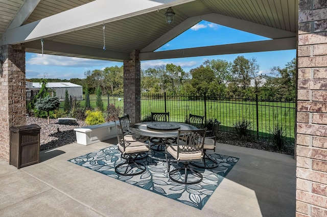 view of patio featuring outdoor dining area and a fenced backyard