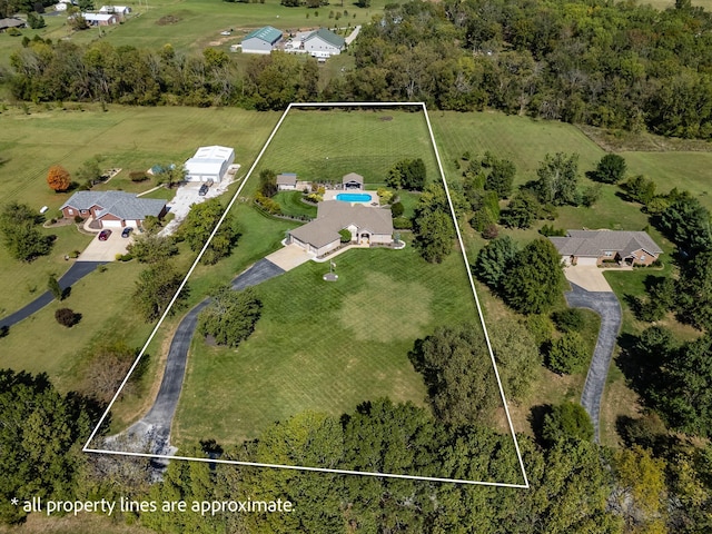 birds eye view of property with a rural view