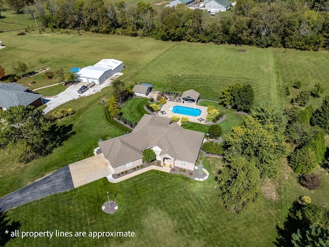 birds eye view of property with a rural view