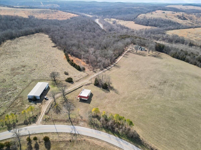 birds eye view of property with a rural view