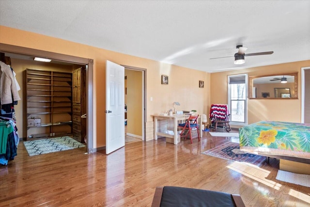 living room featuring baseboards and wood finished floors