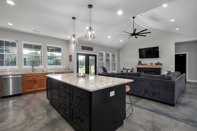 kitchen with french doors, stainless steel dishwasher, a fireplace, and finished concrete floors