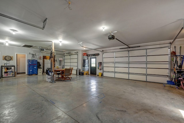 garage featuring a garage door opener