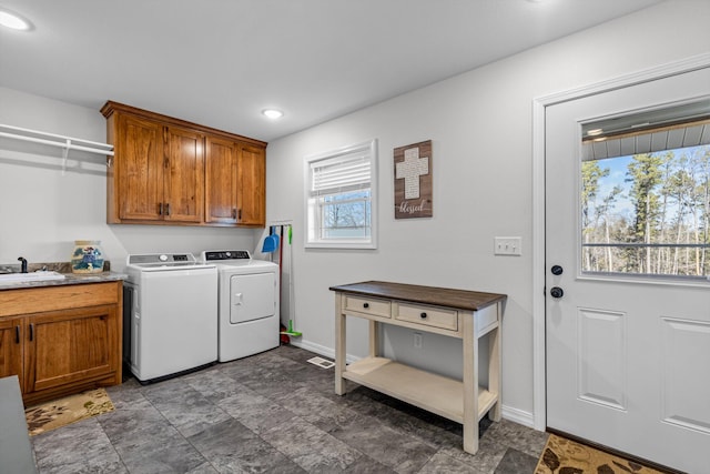 15221 Cleveland Rd, Houston, MO 65483 - laundry area featuring washing machine and clothes dryer, recessed lighting, cabinet space, a sink, and baseboards