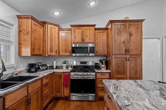 15221 Cleveland Rd, Houston, MO 65483 - kitchen with lofted ceiling, stainless steel appliances, a sink, and brown cabinets
