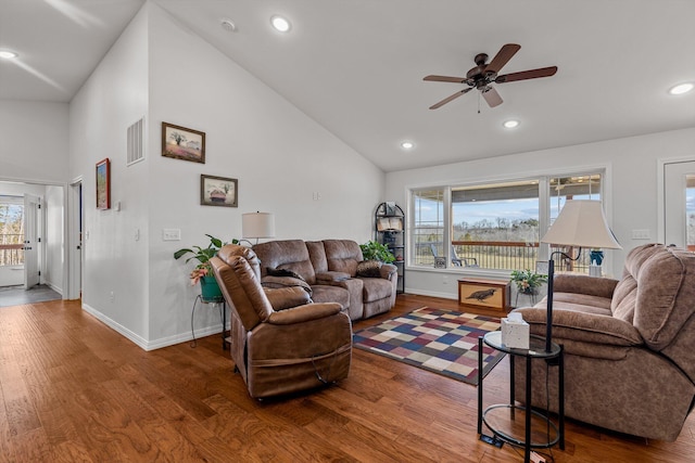15221 Cleveland Rd, Houston, MO 65483 - living area with wood finished floors, visible vents, and a healthy amount of sunlight