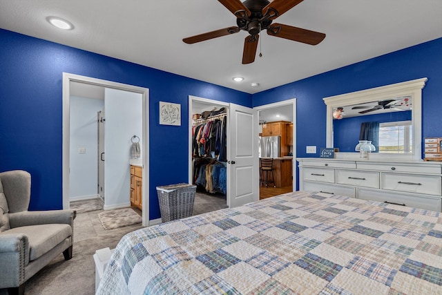 15221 Cleveland Rd, Houston, MO 65483 - bedroom featuring a walk in closet, carpet, a closet, freestanding refrigerator, and connected bathroom