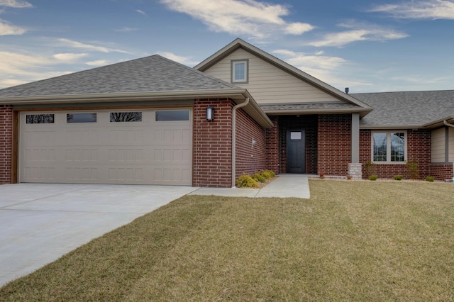 view of front of property featuring an attached garage, brick siding, a shingled roof, driveway, and a front yard