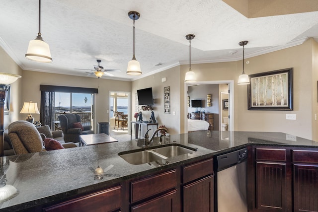 kitchen with dishwasher, open floor plan, decorative light fixtures, a textured ceiling, and a sink