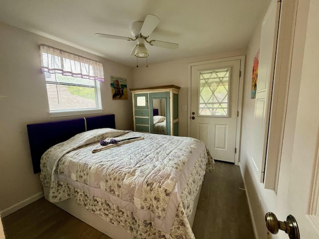 bedroom featuring dark wood-type flooring, ceiling fan, and baseboards