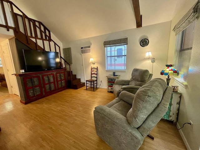 living room featuring vaulted ceiling with beams, stairway, a wall mounted air conditioner, and wood finished floors