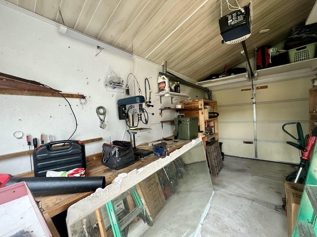 garage featuring a workshop area and a garage door opener