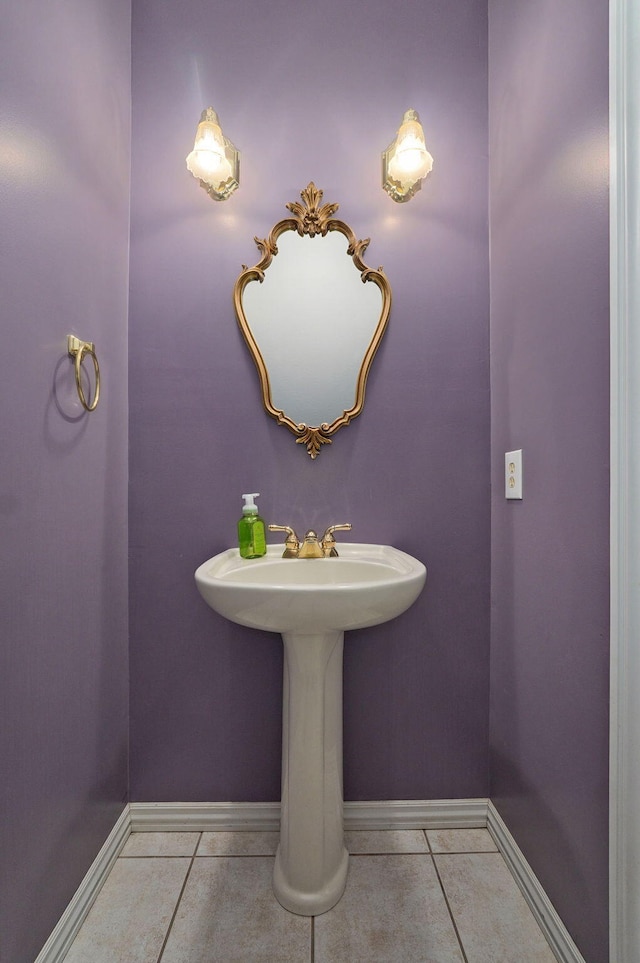 bathroom with tile patterned flooring and baseboards