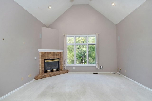 unfurnished living room featuring carpet, a fireplace, baseboards, and visible vents