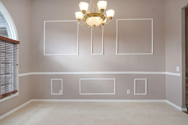 interior space with carpet floors and an inviting chandelier