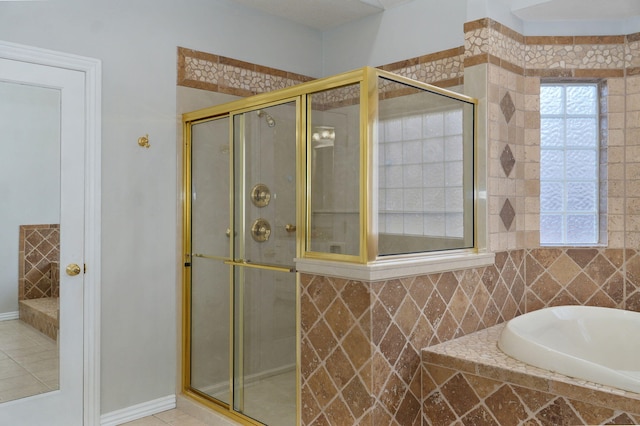 full bathroom with a stall shower and a bath