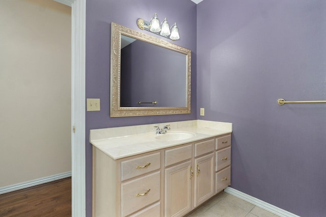 bathroom with baseboards and vanity