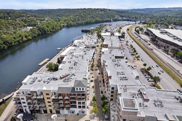 aerial view featuring a water view and a wooded view