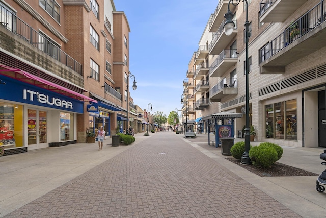 exterior space with street lighting and sidewalks