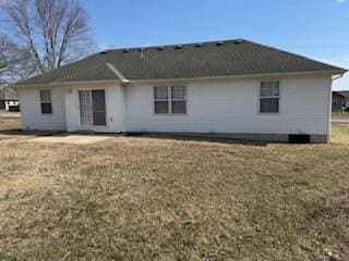 back of house with a yard