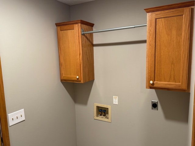 laundry area featuring washer hookup, cabinet space, and electric dryer hookup