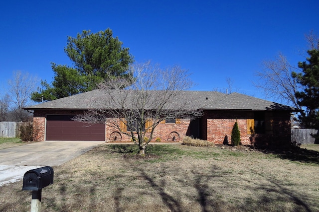 ranch-style house with brick siding, concrete driveway, an attached garage, fence, and a front lawn