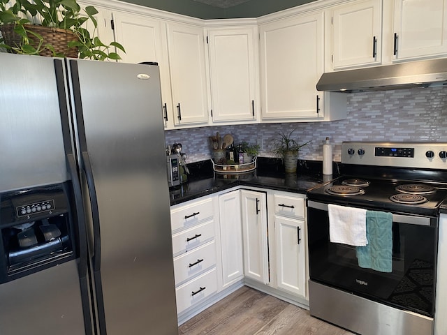 kitchen with stainless steel appliances, white cabinetry, and under cabinet range hood